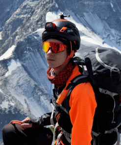 "Nomad Face Bunker Orange Tiger – protector solar outdoor SPF50+ diseñado para montañismo y deportes de altura."