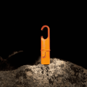 "Protector solar Nomad Face Orange Tiger – diseño compacto y funcional para uso en montaña, nieve o expediciones outdoor."